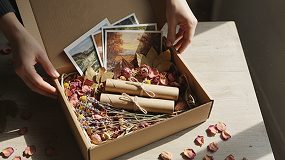 Hands opening a box of craft materials